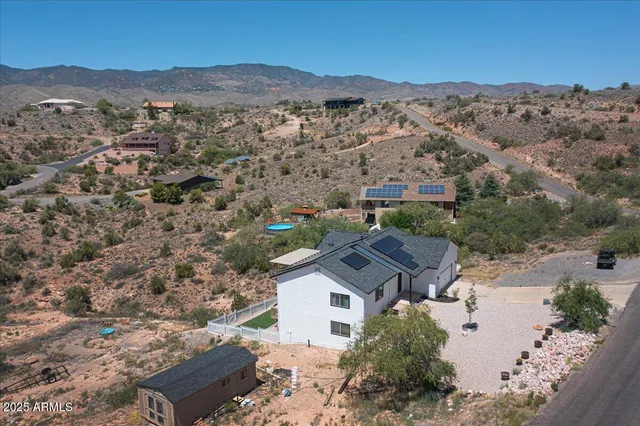 an aerial view of residential houses and trees