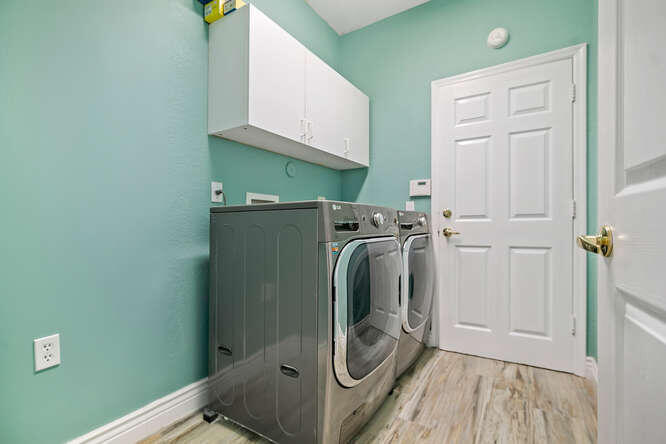20933 La Plata Court Boca Raton, FL 33428 - Photo 23 of 60 a utility room with dryer and washer
