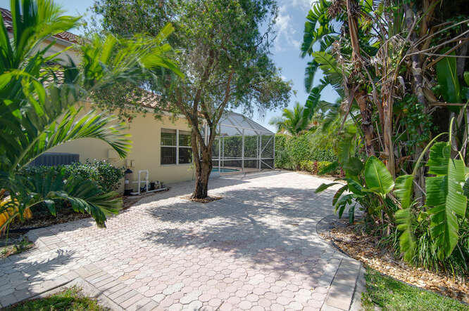 20933 La Plata Court Boca Raton, FL 33428 - Photo 34 of 60 a view of a yard with plants and trees