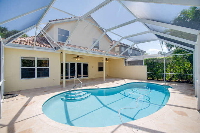 20933 La Plata Court Boca Raton, FL 33428 - Photo 37 of 60 a view of a house with backyard porch and sitting area
