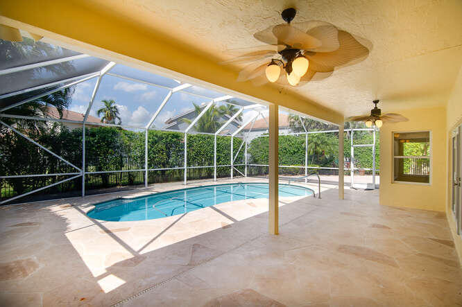 20933 La Plata Court Boca Raton, FL 33428 - Photo 39 of 60 a view of a backyard with a swimming pool