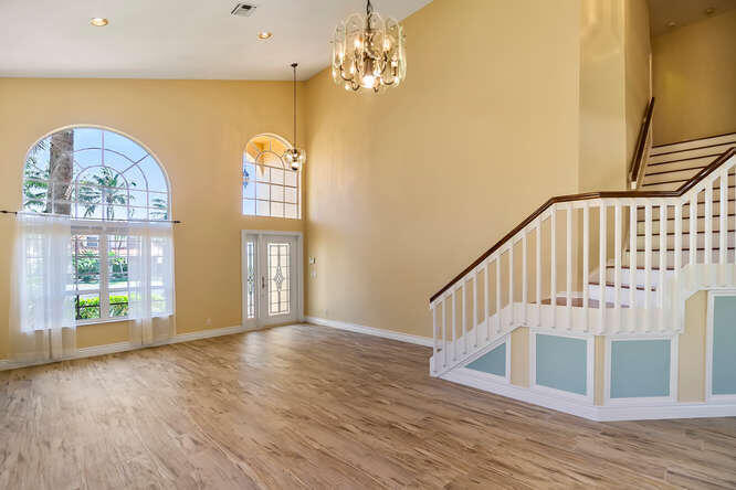 20933 La Plata Court Boca Raton, FL 33428 - Photo 4 of 60 a view of an entryway with wooden floor