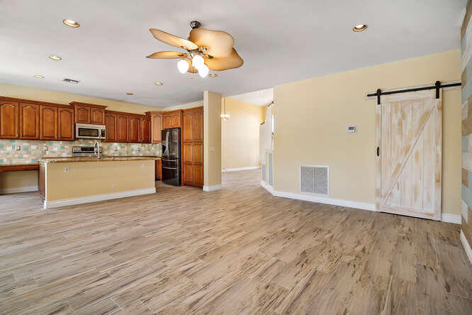 20933 La Plata Court Boca Raton, FL 33428 - Photo 10 of 60 a view of a kitchen with a sink and a refrigerator