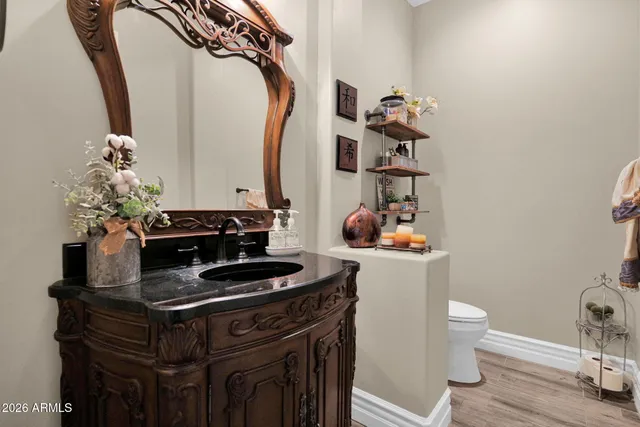 a view of a livingroom with furniture wooden floor and windows