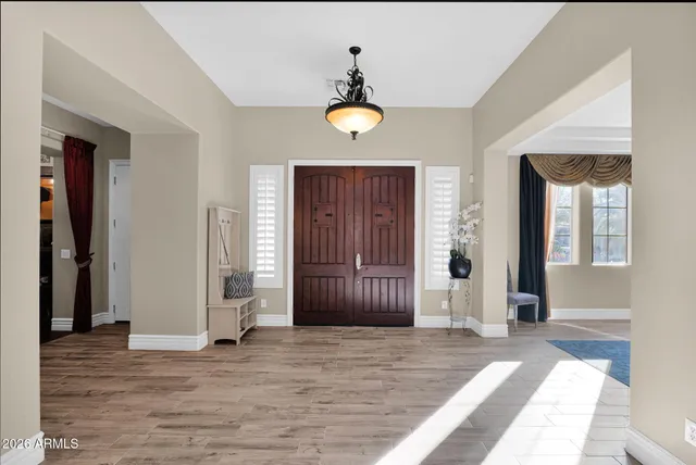 a spacious bedroom with a bed and a couch