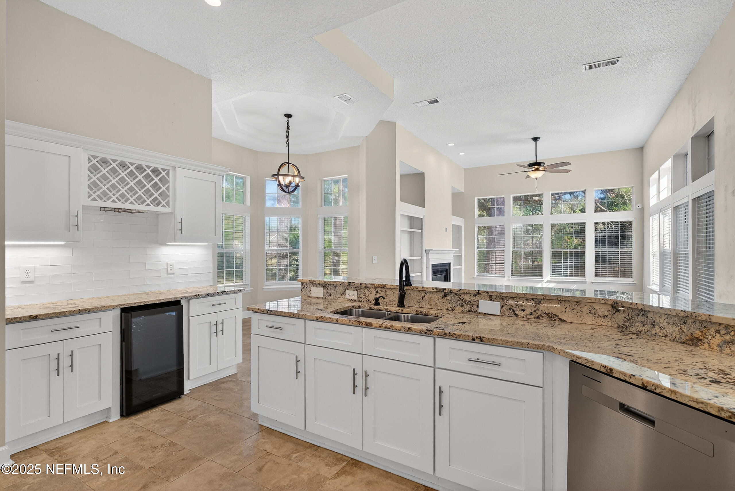 577 Hunters Grove Court Orange Park, FL 32073 - Photo 15 of 40 a kitchen with granite countertop a sink and a window