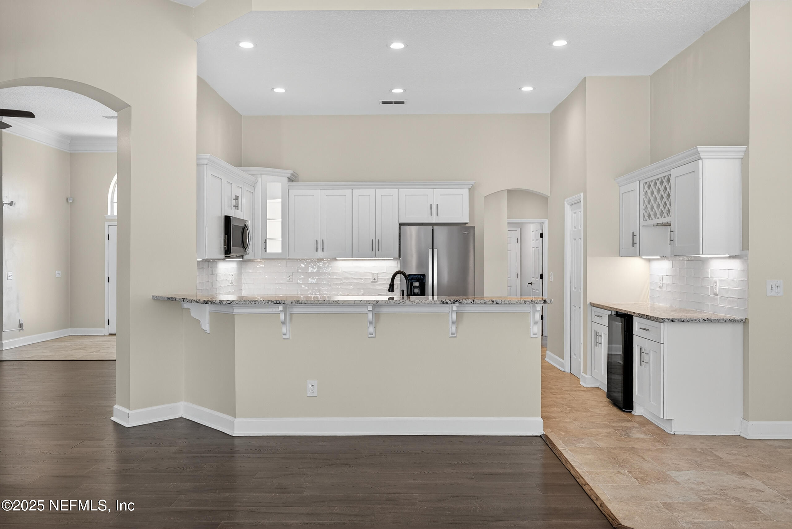 577 Hunters Grove Court Orange Park, FL 32073 - Photo 18 of 40 a large white kitchen with stainless steel appliances