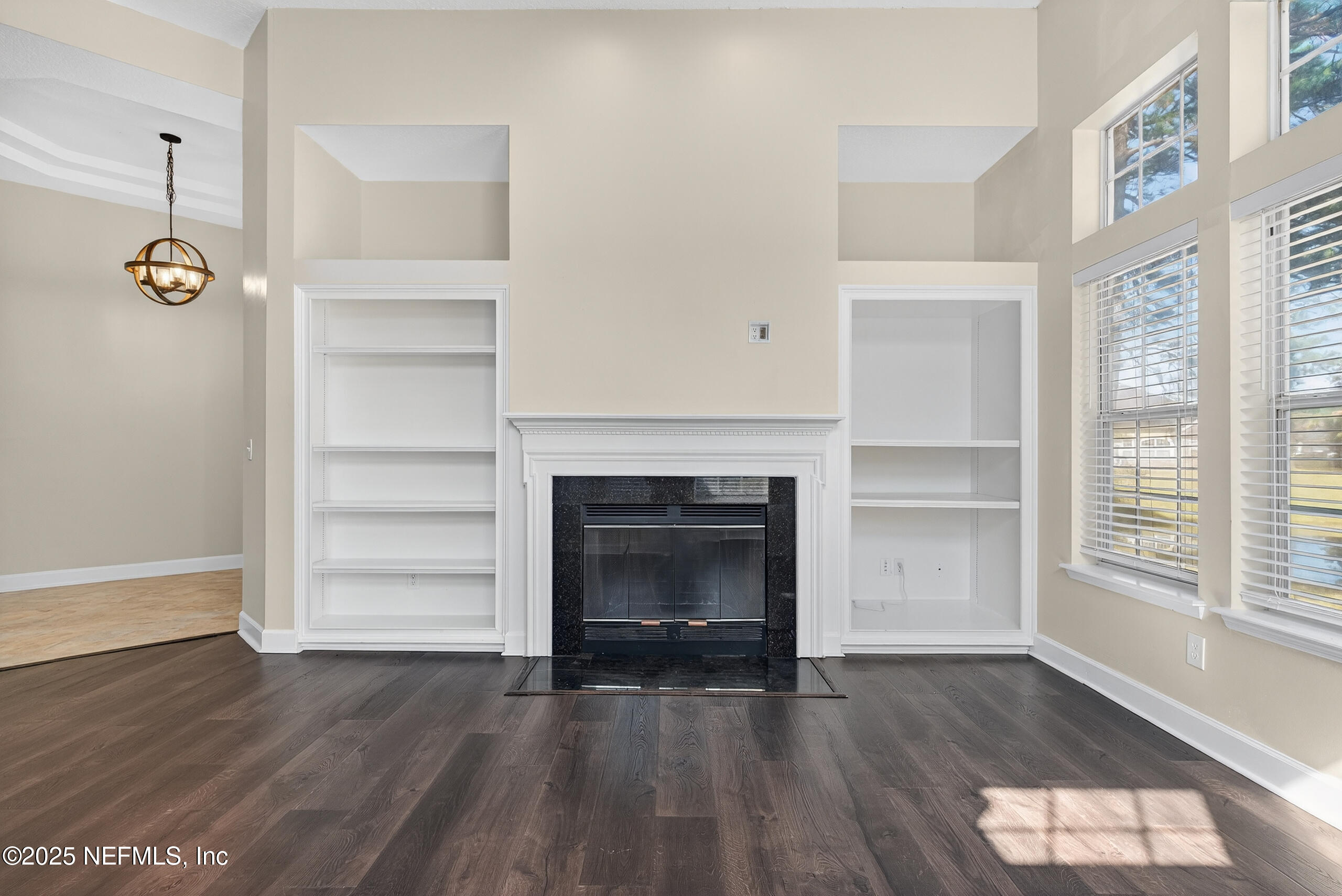 577 Hunters Grove Court Orange Park, FL 32073 - Photo 21 of 40 a living room with a fireplace and wooden floor
