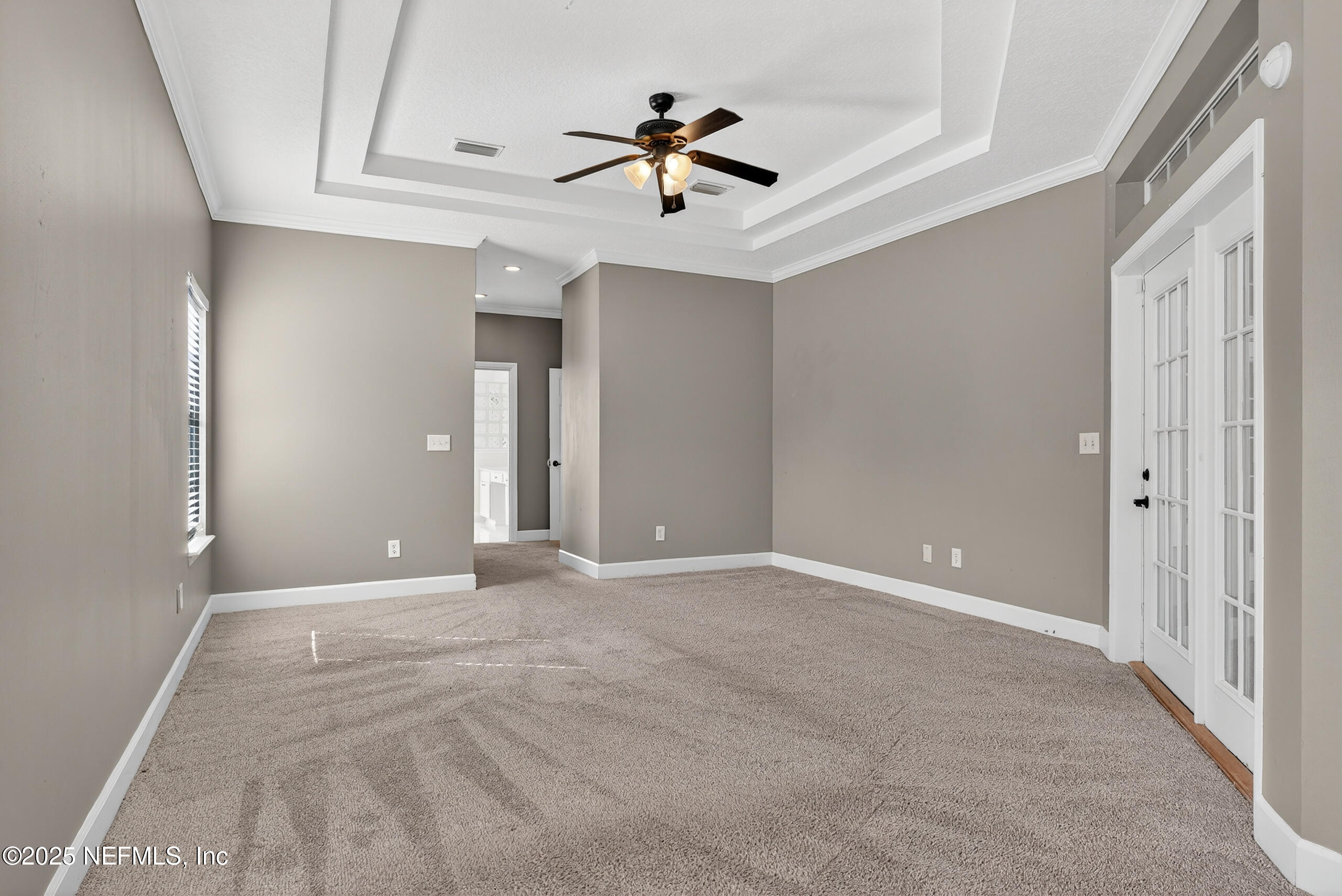 577 Hunters Grove Court Orange Park, FL 32073 - Photo 24 of 40 a view of an empty room with a ceiling fan
