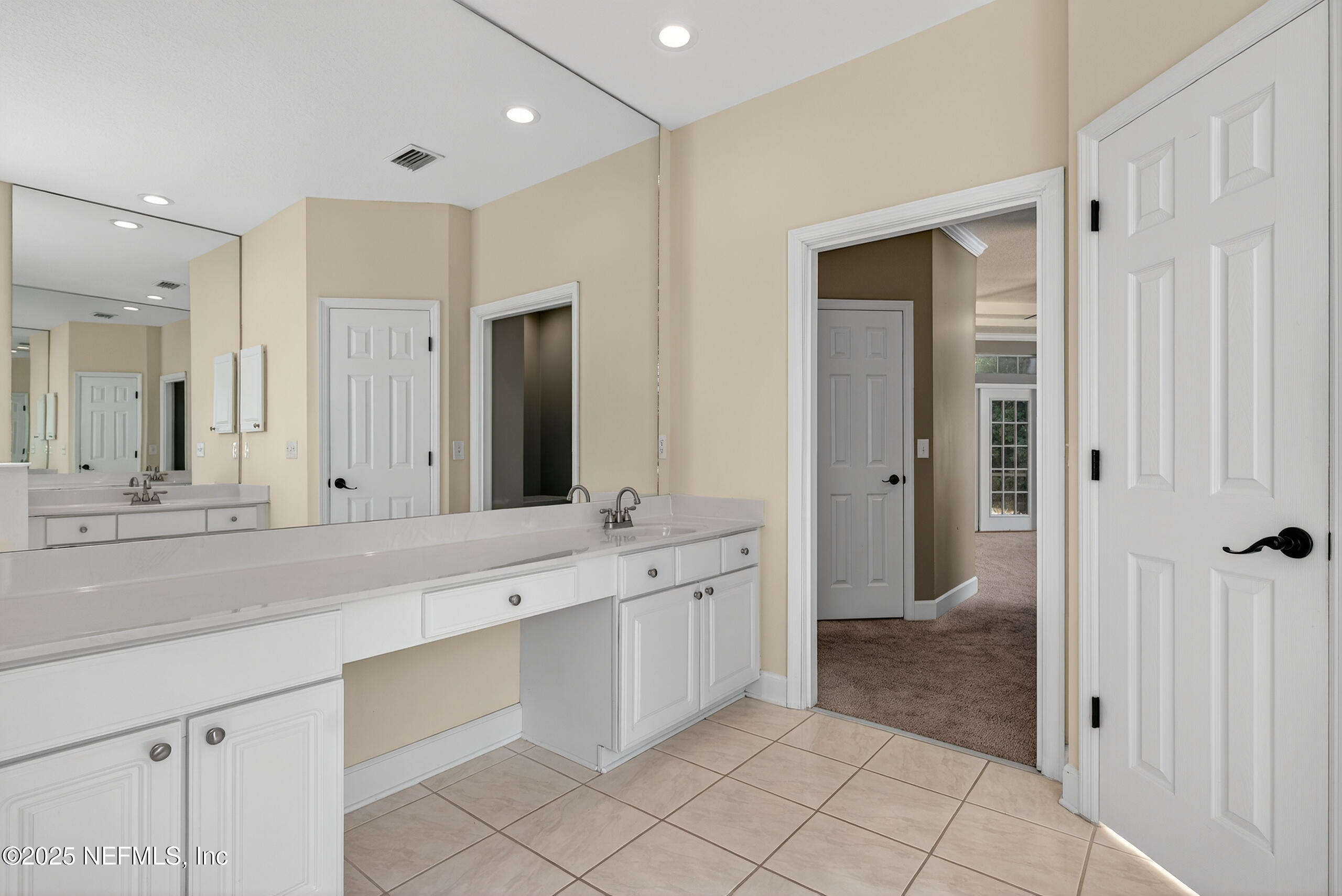 577 Hunters Grove Court Orange Park, FL 32073 - Photo 25 of 40 a spacious bathroom with a granite countertop sink mirror and shower