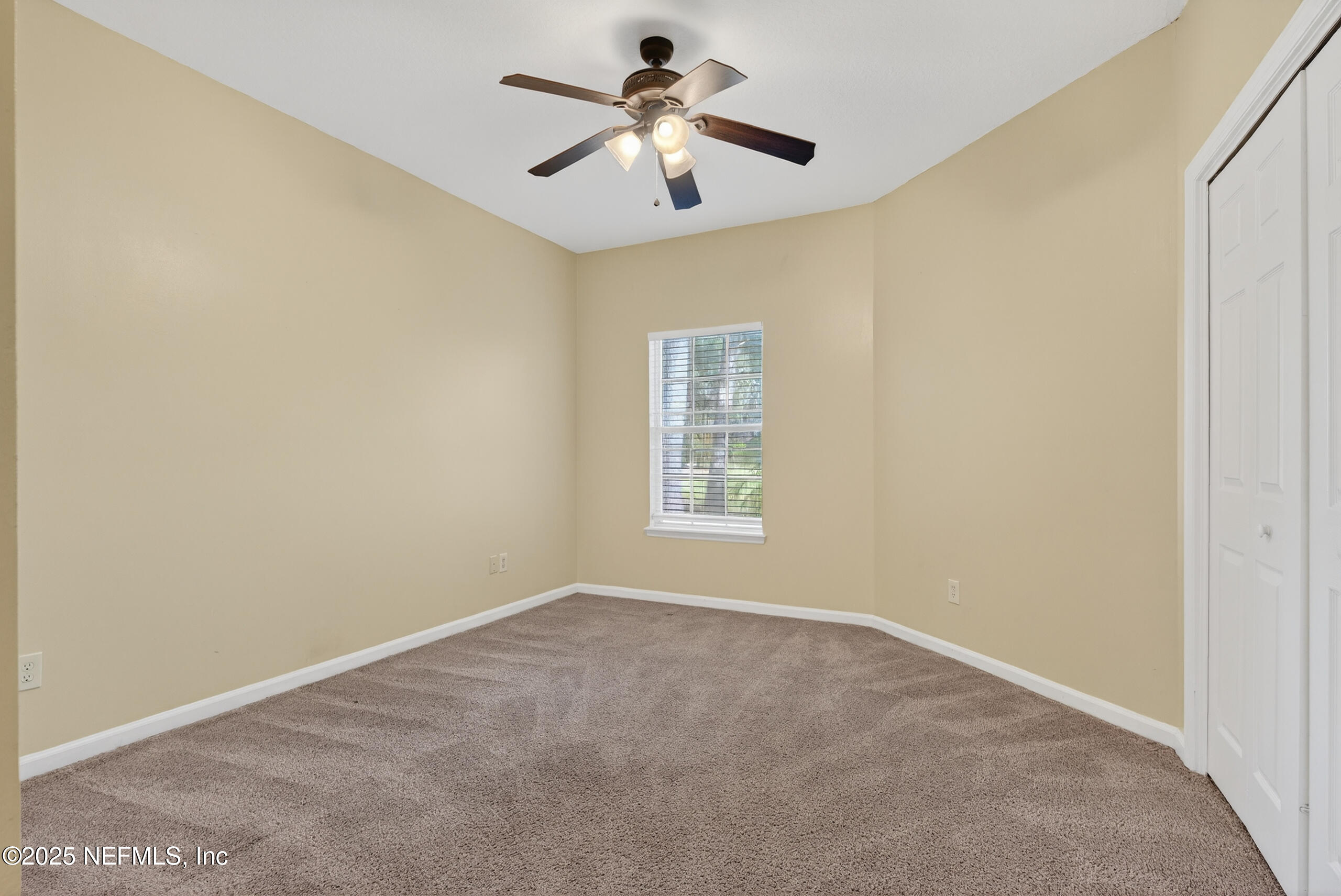 577 Hunters Grove Court Orange Park, FL 32073 - Photo 28 of 40 a view of a room with a ceiling fan and a window