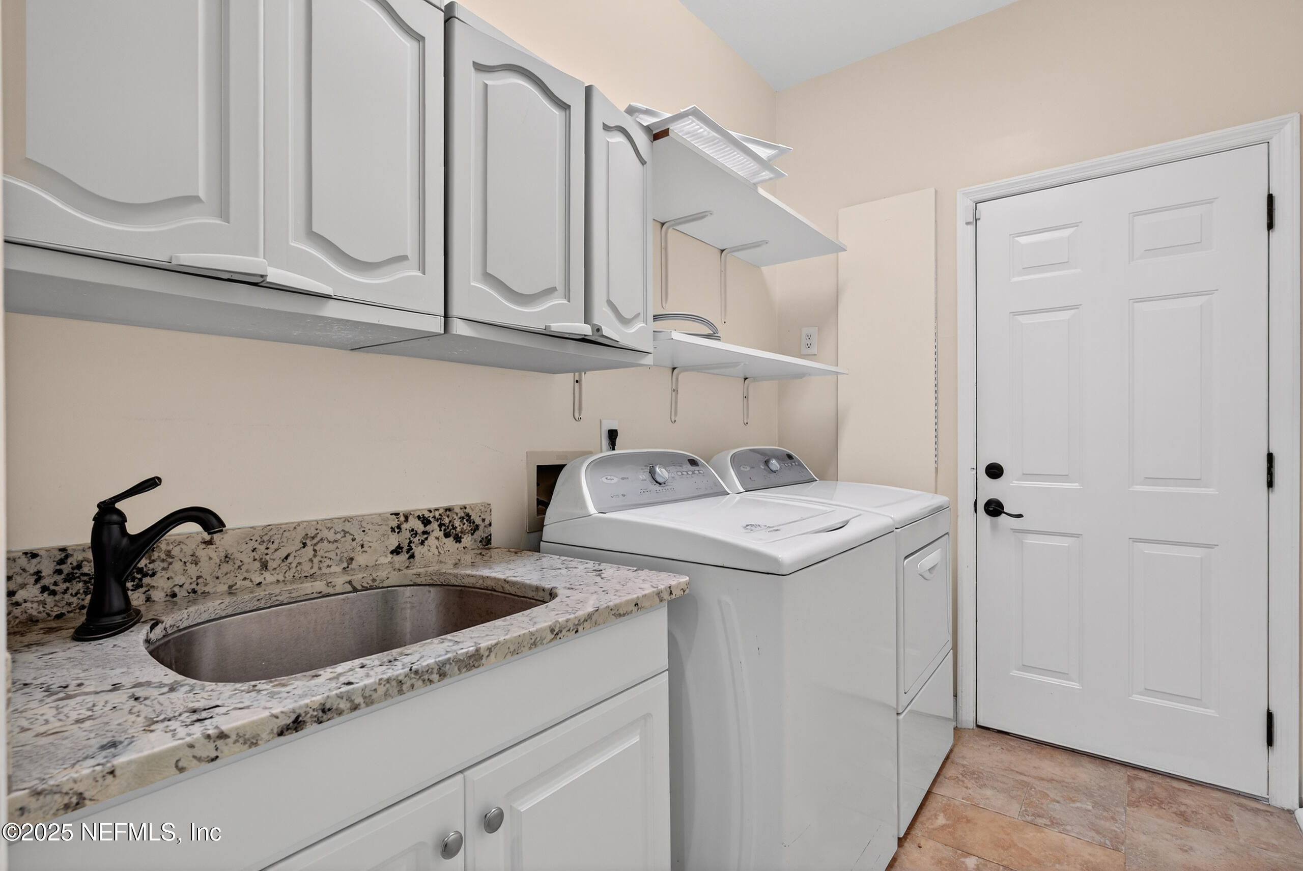577 Hunters Grove Court Orange Park, FL 32073 - Photo 36 of 40 a utility room with dryer and sink