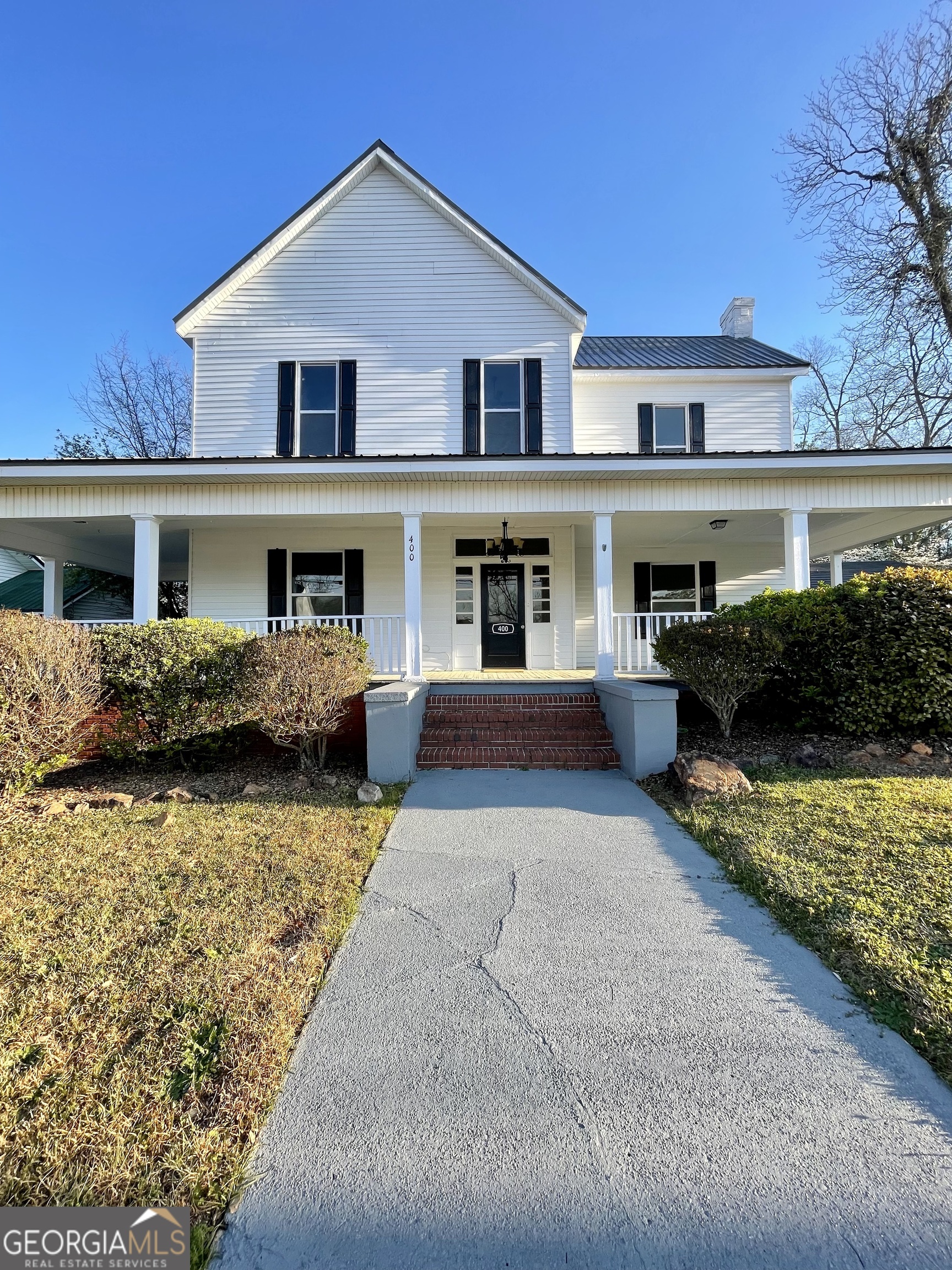 a front view of a house with swimming pool
