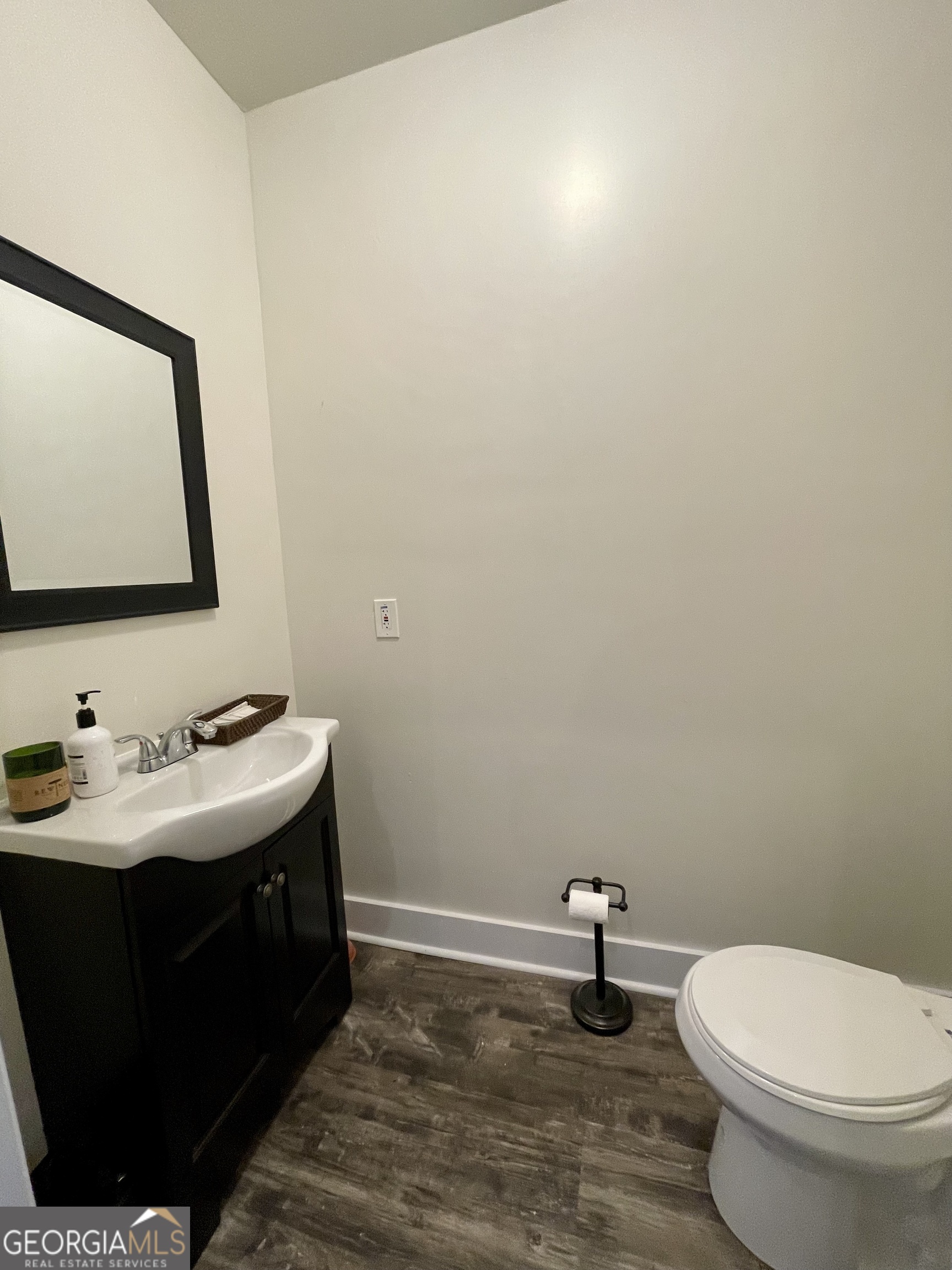 400 West Gordon Street Thomaston, GA 30286 - Photo 13 of 43 a bathroom with a sink a toilet and mirror