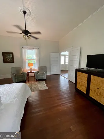 a living room with a flat screen tv and a fireplace