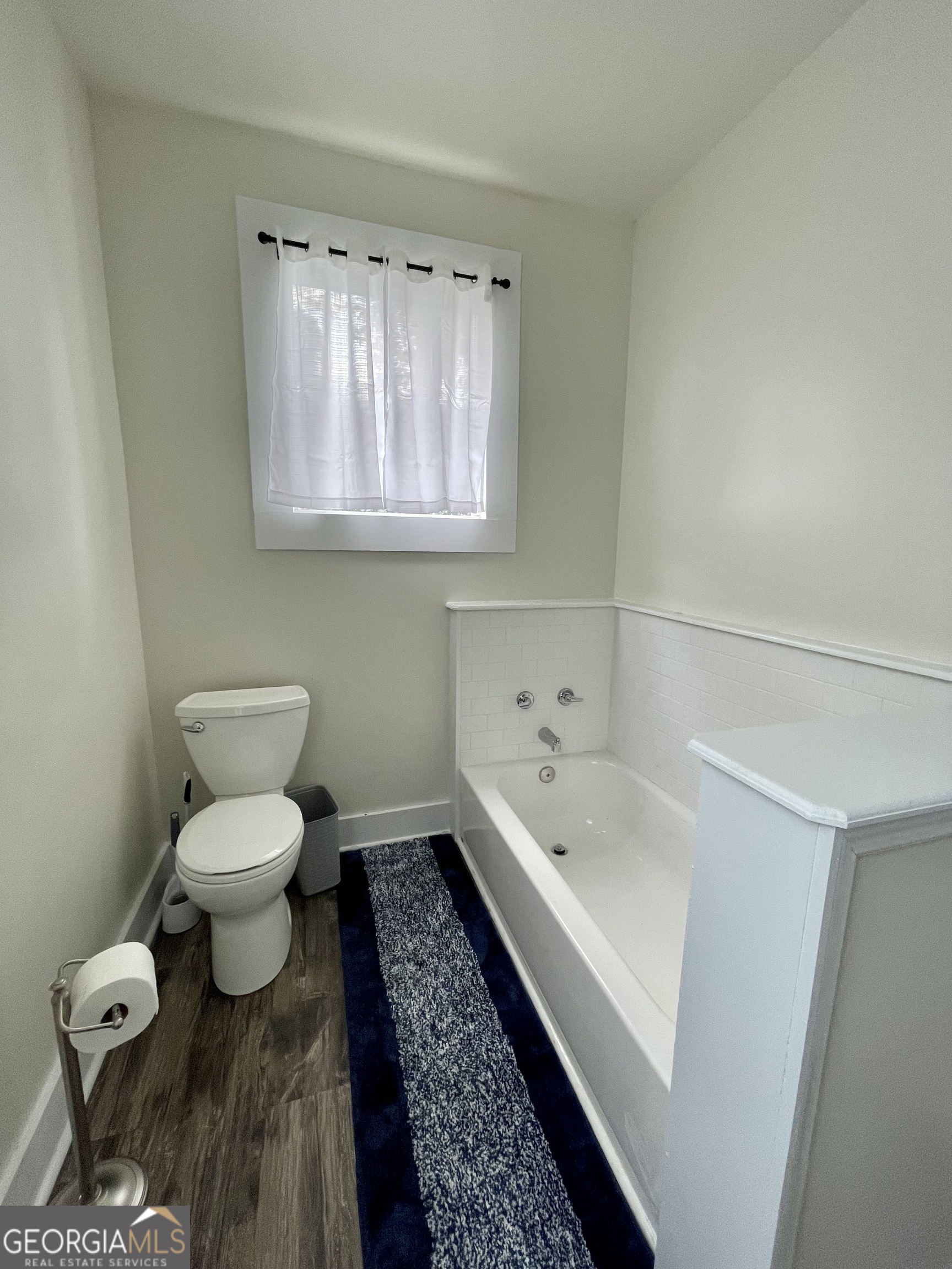 400 West Gordon Street Thomaston, GA 30286 - Photo 21 of 43 a bathroom with a toilet sink and mirror