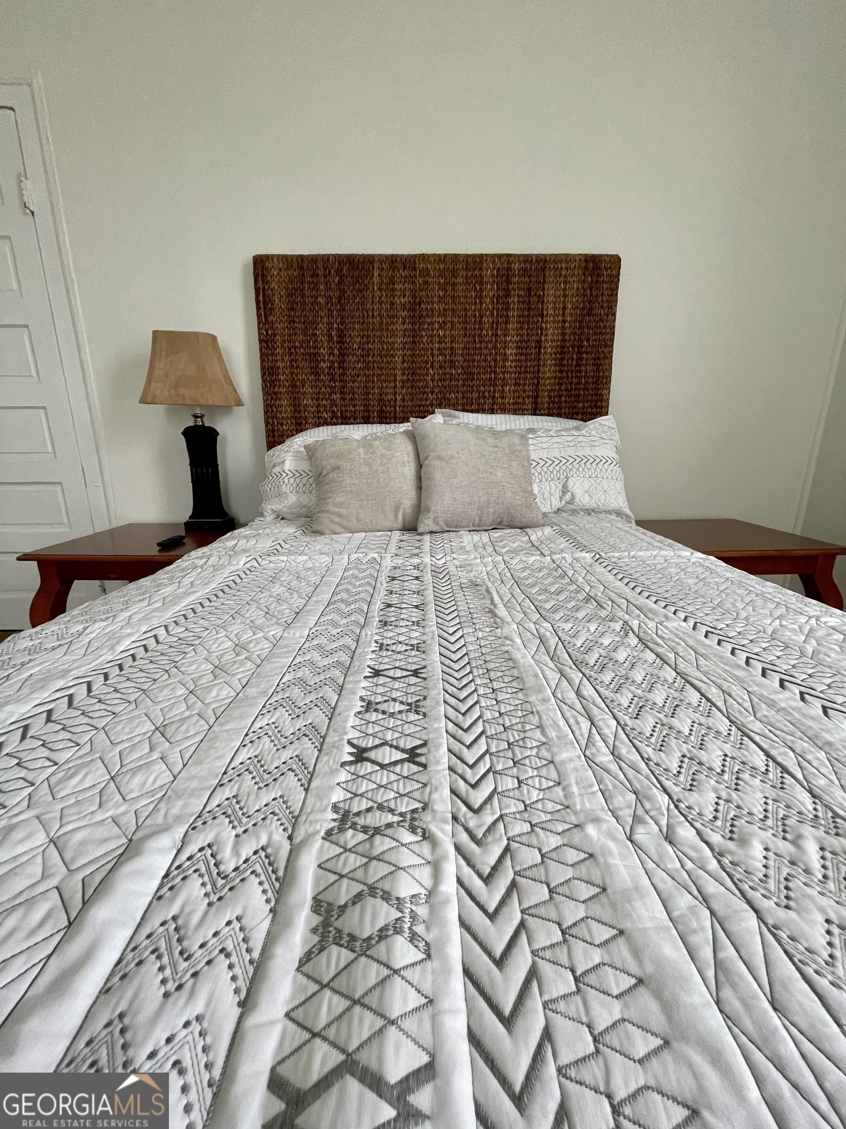 400 West Gordon Street Thomaston, GA 30286 - Photo 26 of 43 a bedroom with a bed and wooden floor