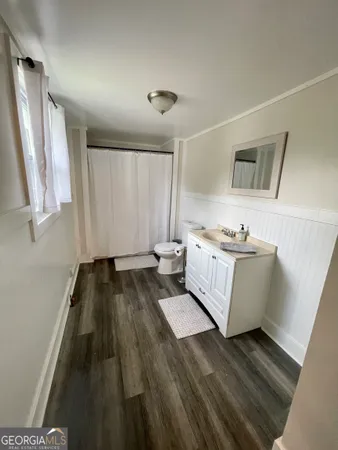 a bathroom with a bathtub and a window