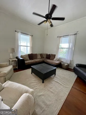 a living room with furniture and a window