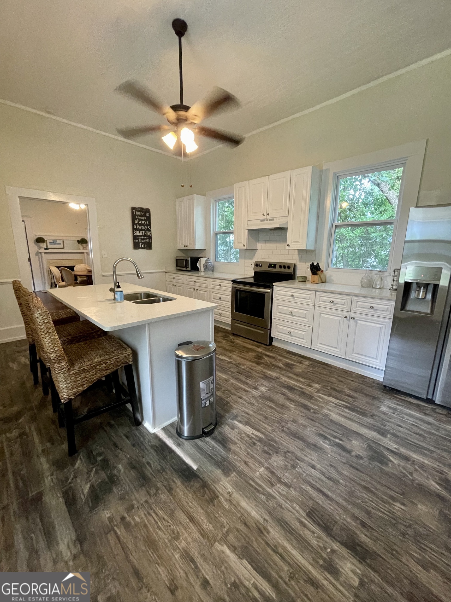 400 West Gordon Street Thomaston, GA 30286 - Photo 8 of 43 a kitchen with a stove a sink and a refrigerator