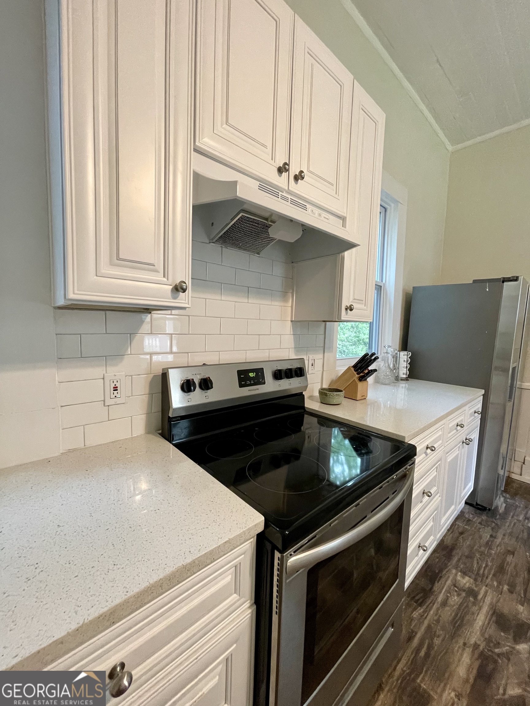 400 West Gordon Street Thomaston, GA 30286 - Photo 10 of 43 a kitchen with stainless steel appliances granite countertop a stove a sink and a microwave