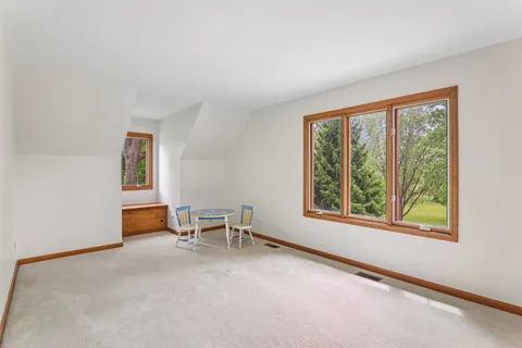 a view of a livingroom with furniture and a window