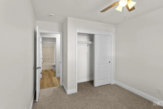 an empty room with a bathroom