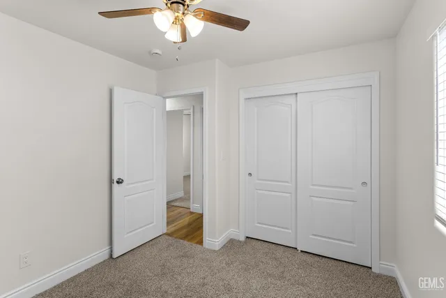 an empty room with fan