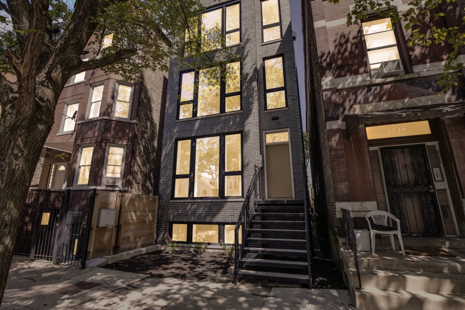 1732 West 19th Street, Unit 1 Chicago, IL 60608 - Photo 1 of 17 a view of a brick house with many windows
