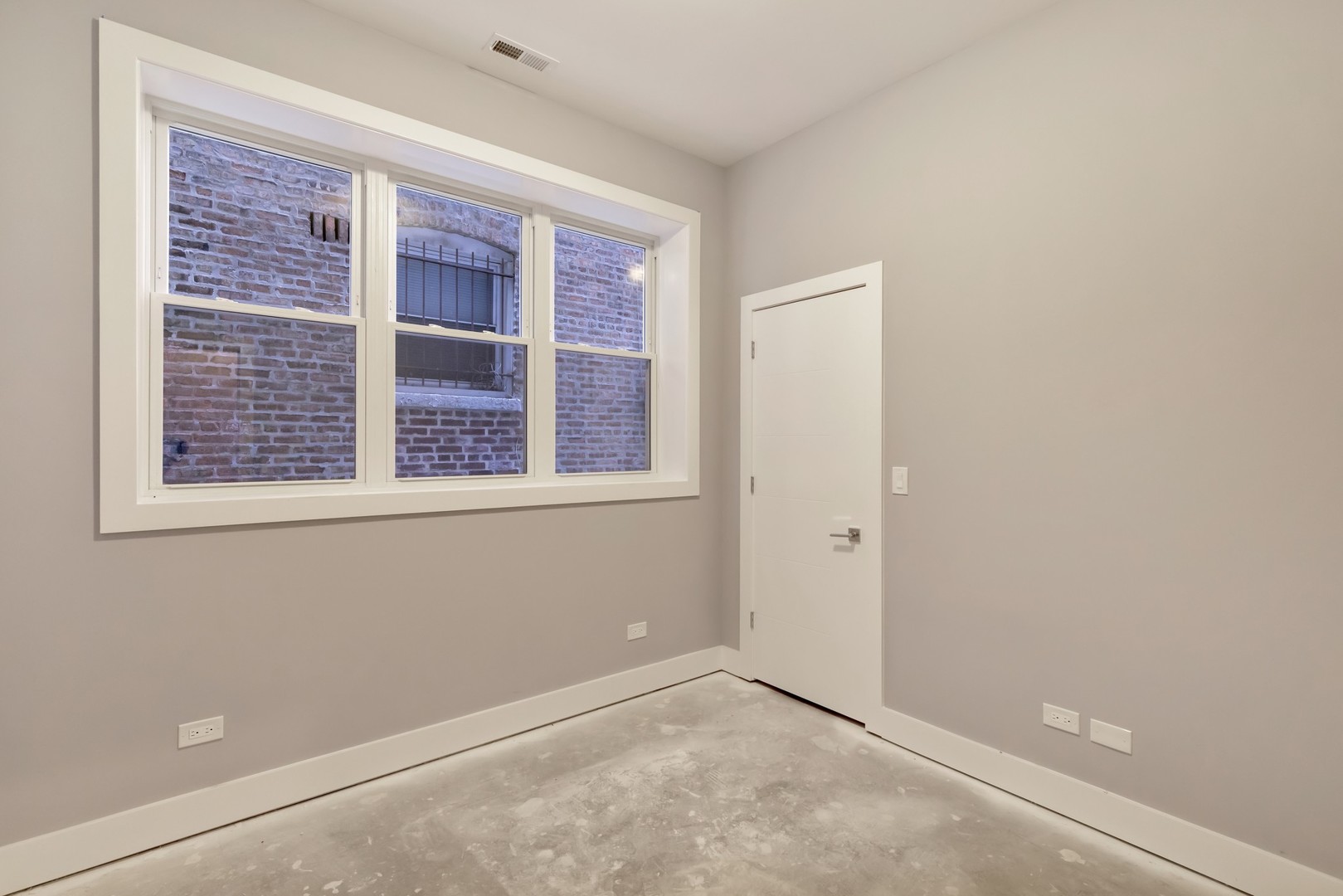 1732 West 19th Street, Unit 1 Chicago, IL 60608 - Photo 11 of 17 an empty room with windows