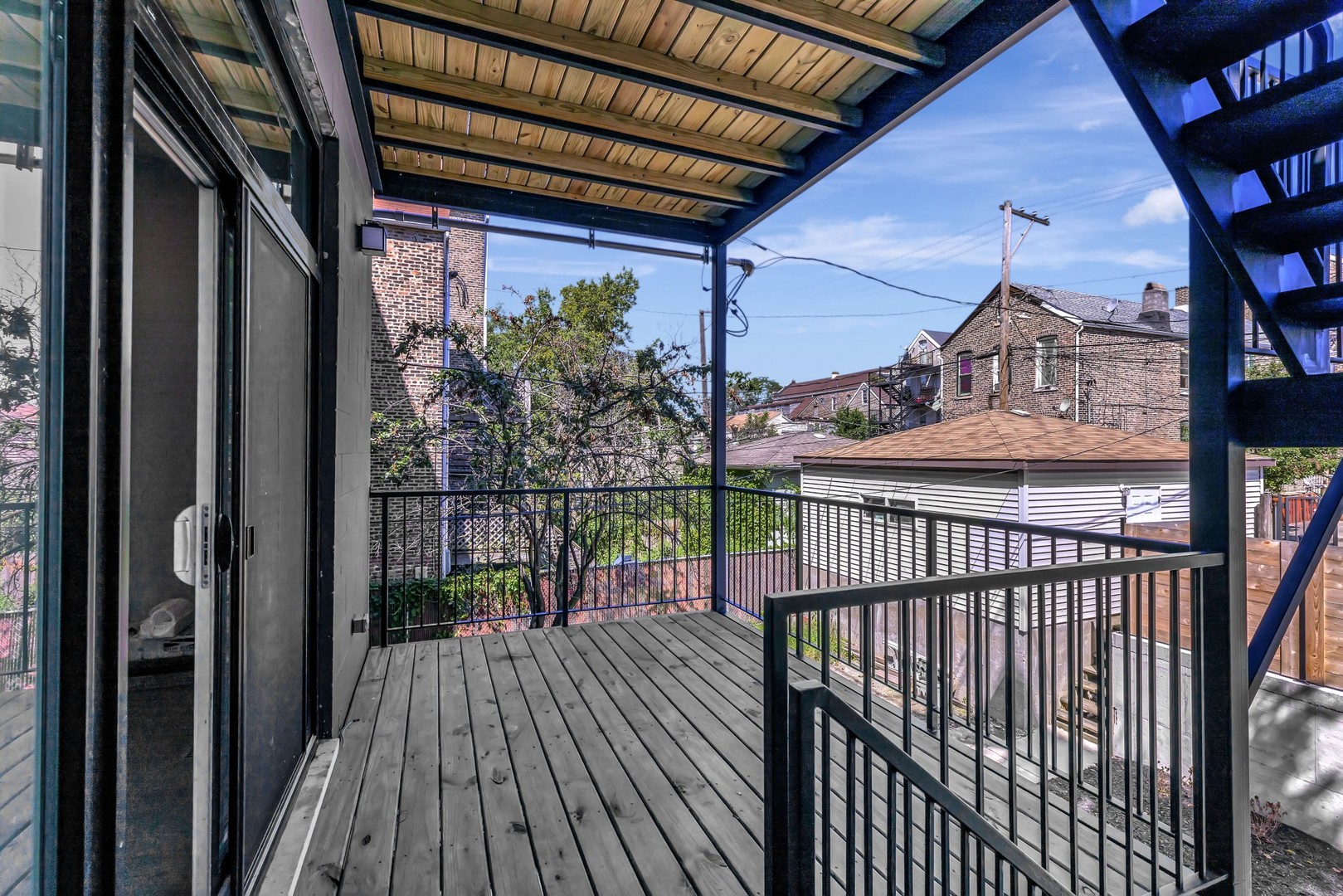 1732 West 19th Street, Unit 1 Chicago, IL 60608 - Photo 14 of 17 a view of a balcony with wooden floor