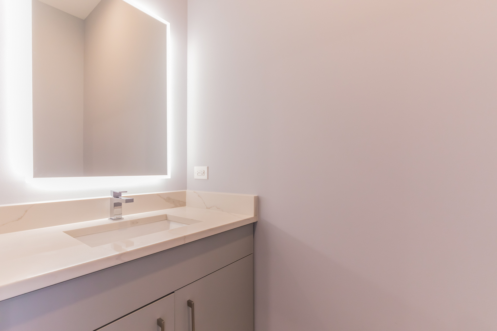 1732 West 19th Street, Unit 1 Chicago, IL 60608 - Photo 4 of 17 a bathroom with a sink and a mirror