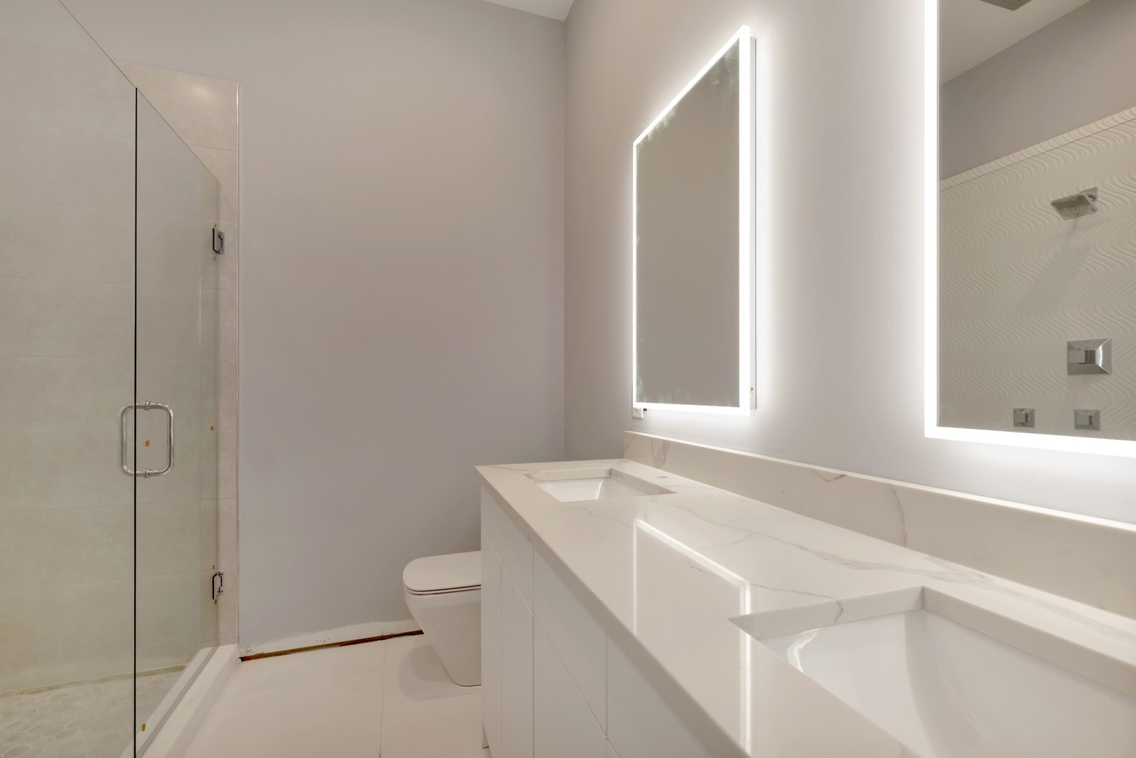 1732 West 19th Street, Unit 1 Chicago, IL 60608 - Photo 10 of 17 a bathroom with a granite countertop sink mirror vanity and toilet