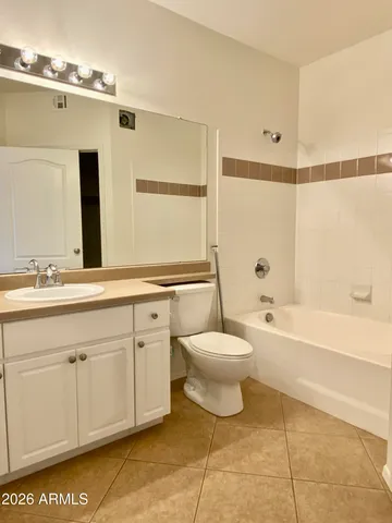 a bathroom with a toilet a sink and bathtub