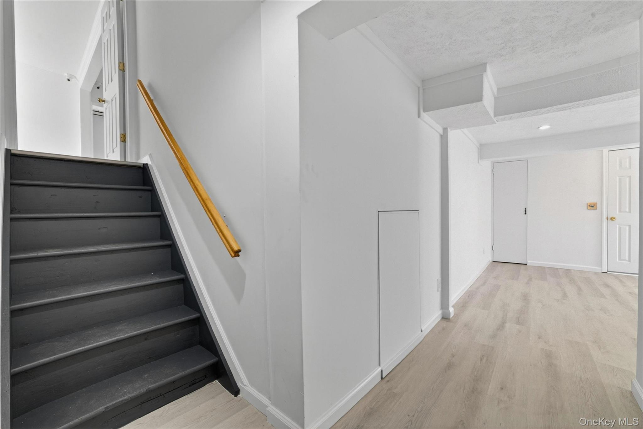 263 Croydon Road Yonkers, NY 10710 - Photo 28 of 43 a view of staircase with wooden floor and white walls