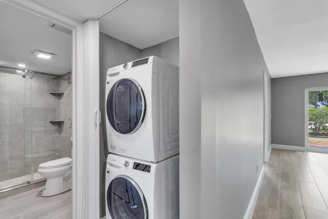 a view of a hallway with washer and dryer