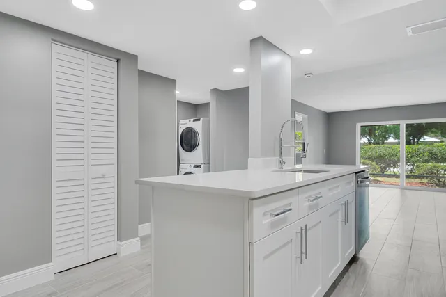 a view with a sink and mirror with window