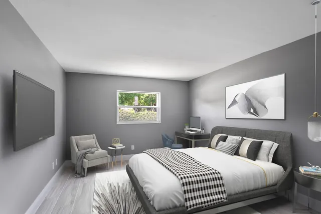 a bedroom with bed and window