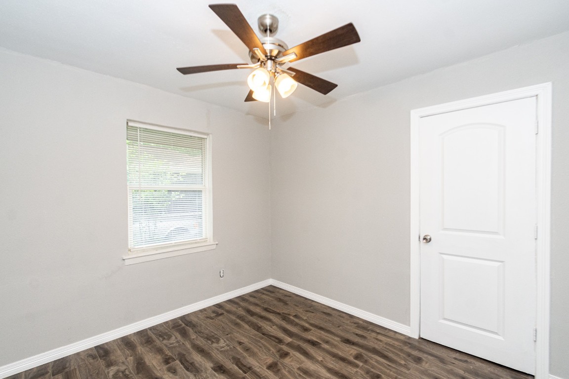 2002 Nottingham Street Pasadena, TX 77502 - Photo 13 of 33 an empty room with windows and fan
