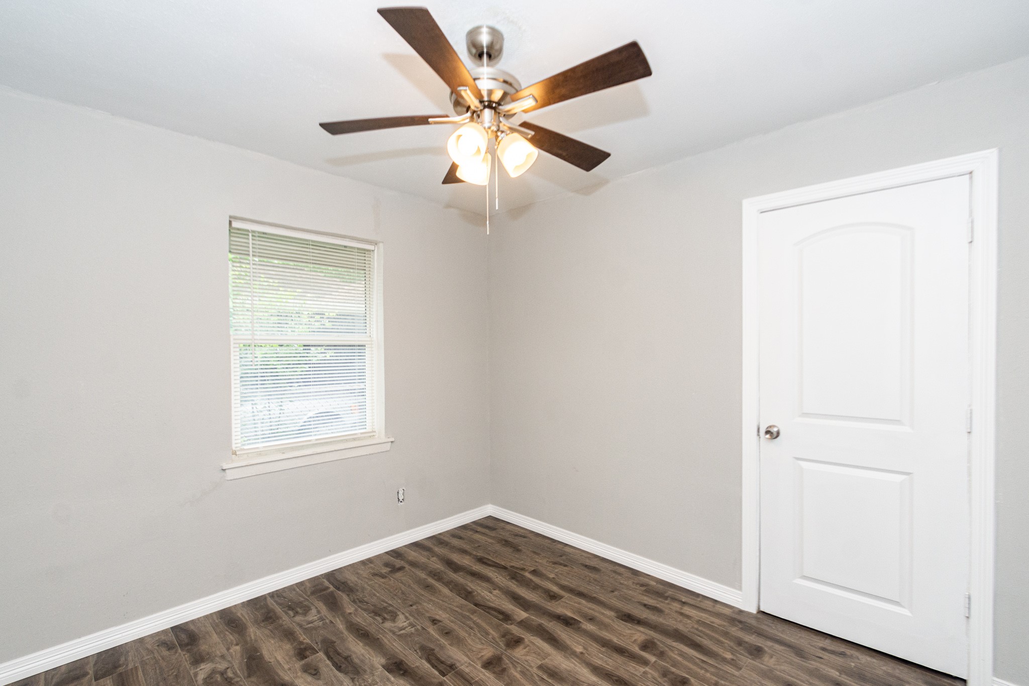 2002 Nottingham Street Pasadena, TX 77502 - Photo 13 of 33 an empty room with windows and fan