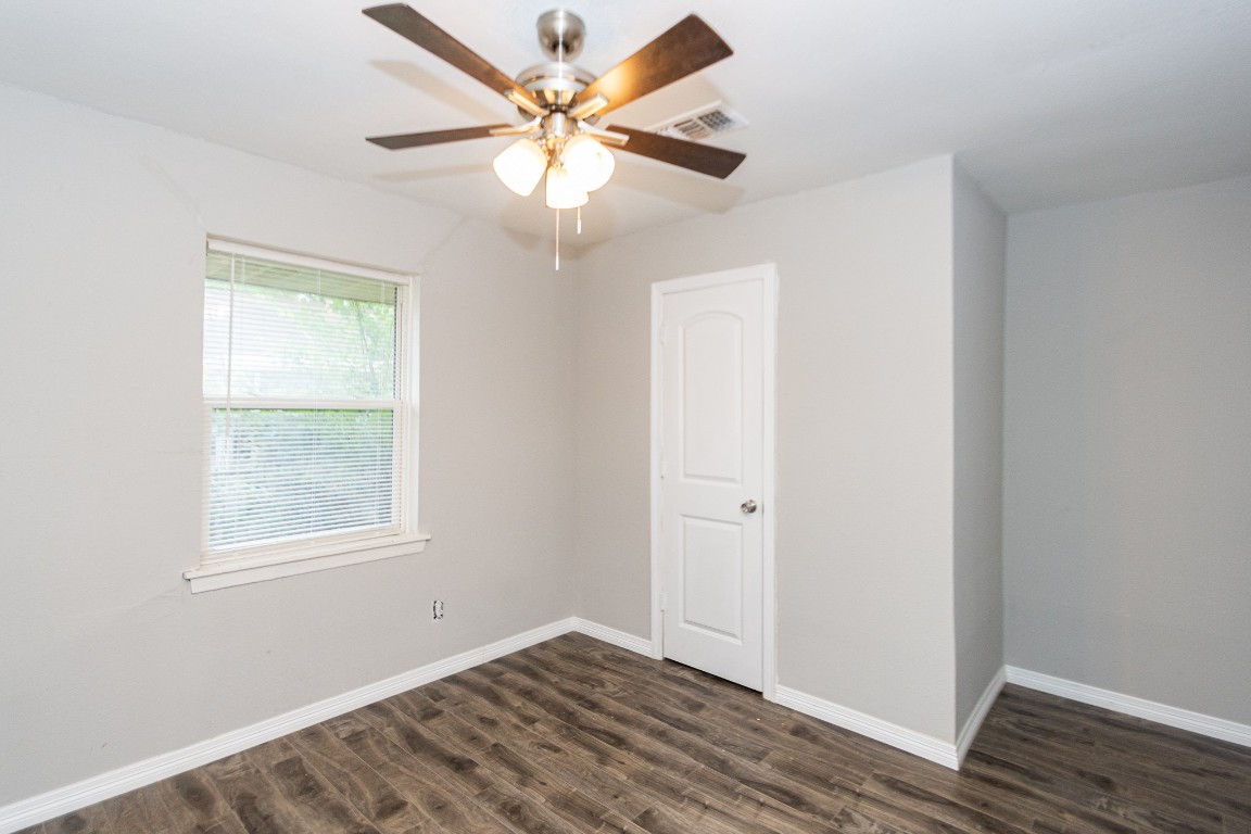 2002 Nottingham Street Pasadena, TX 77502 - Photo 17 of 33 wooden floor in an empty room with a window
