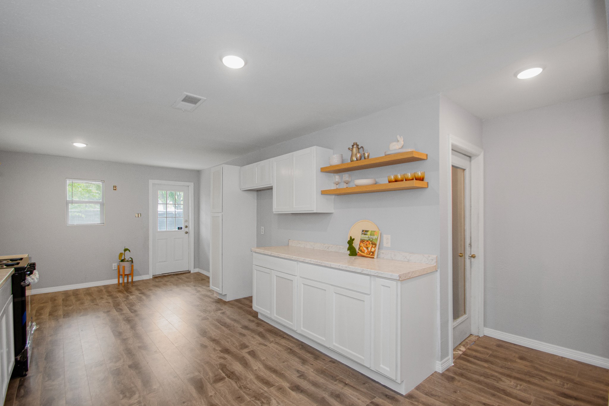 2002 Nottingham Street Pasadena, TX 77502 - Photo 18 of 33 a view of storage and utility room with wooden floor