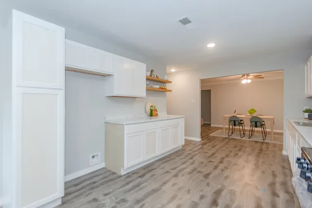 a kitchen with a sink and cabinets