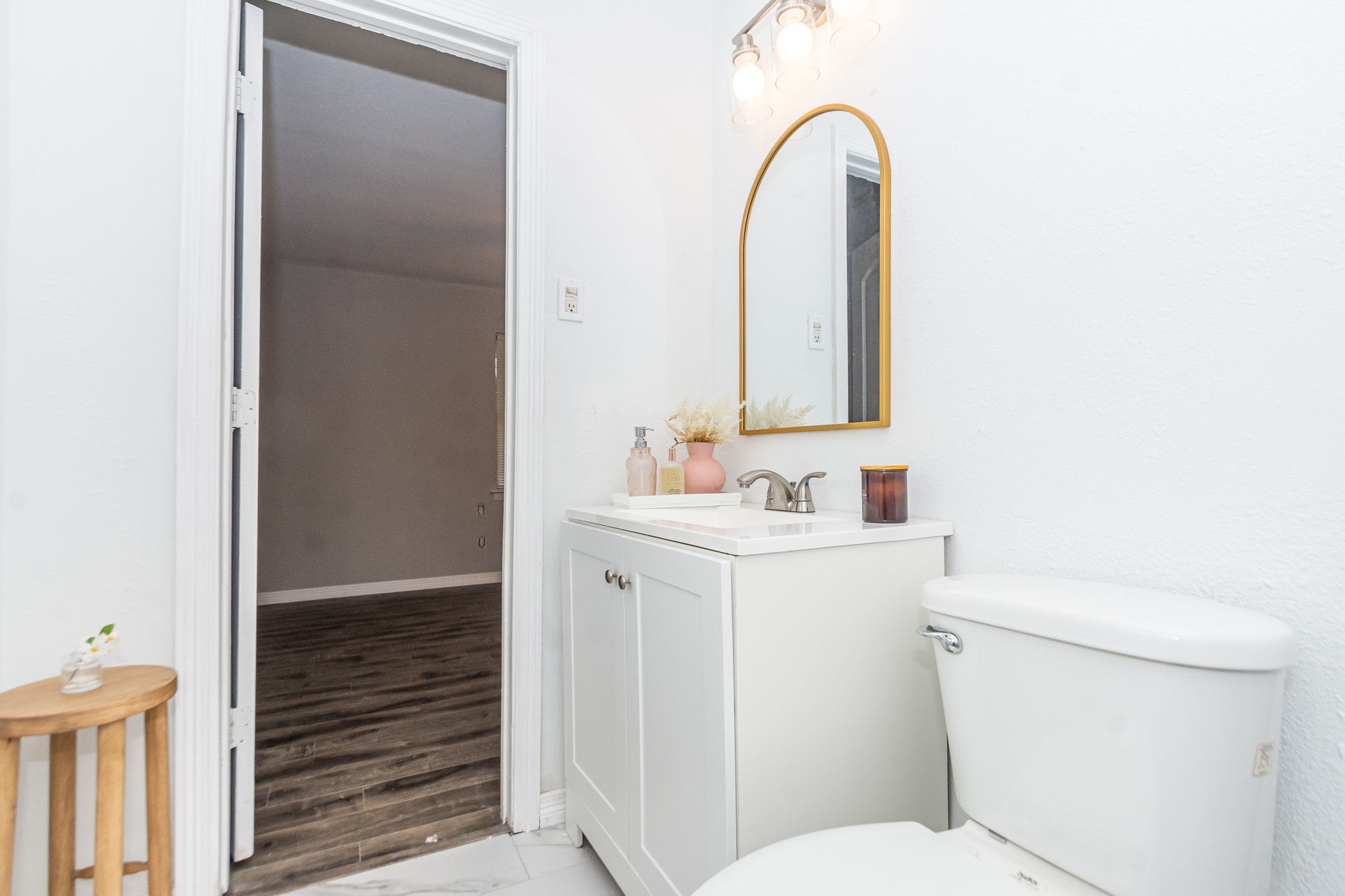 2002 Nottingham Street Pasadena, TX 77502 - Photo 28 of 33 a bathroom with a sink a toilet and a mirror