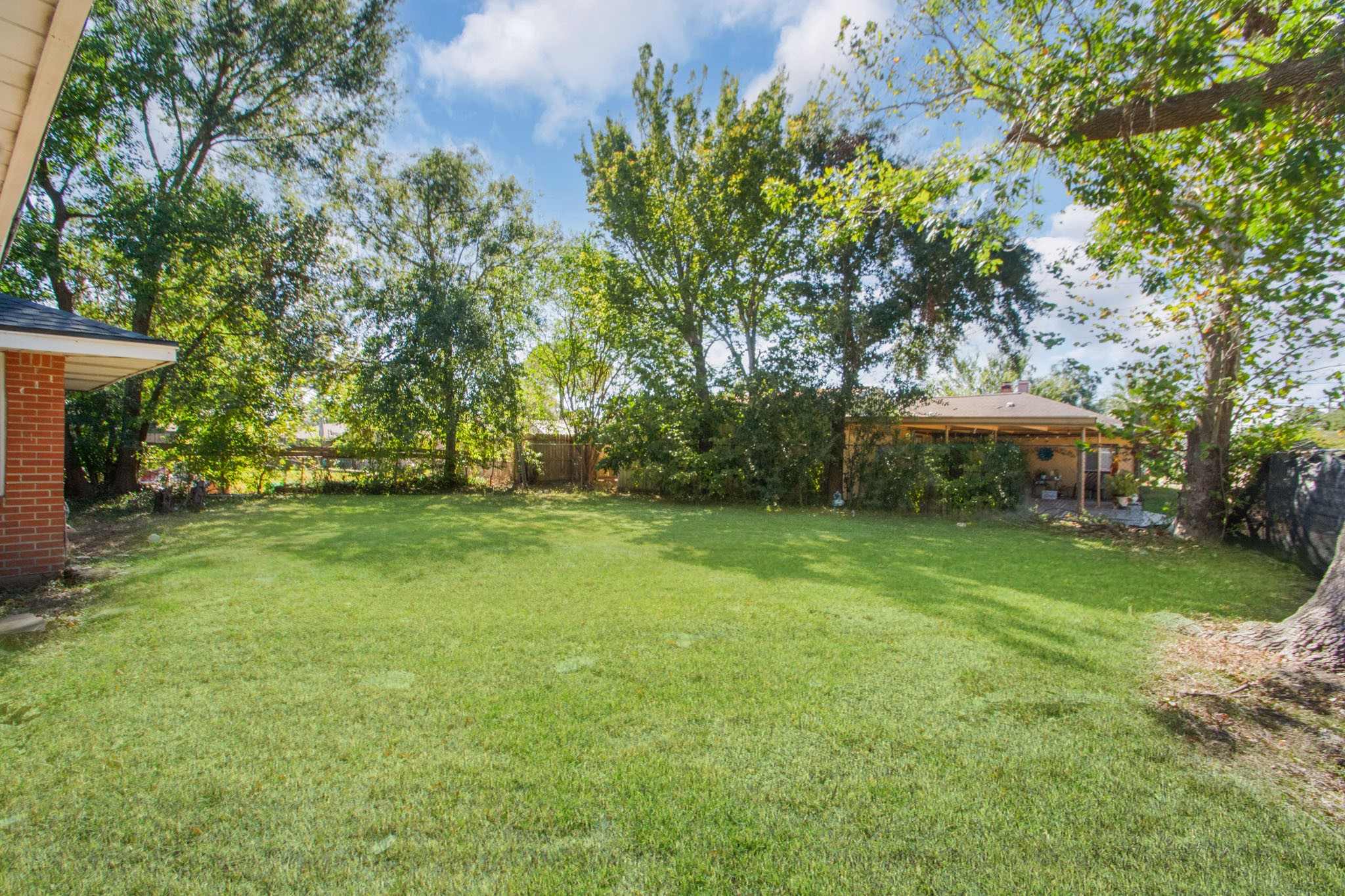 2002 Nottingham Street Pasadena, TX 77502 - Photo 29 of 33 a view of a backyard with large trees