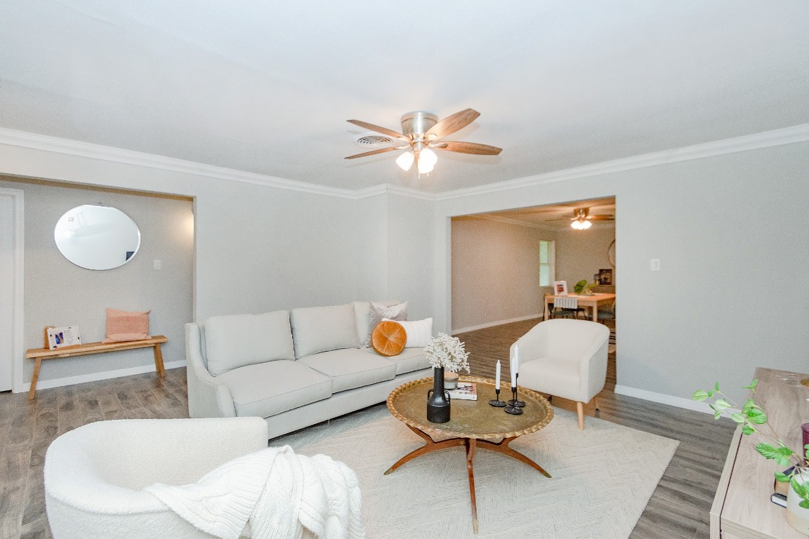 2002 Nottingham Street Pasadena, TX 77502 - Photo 8 of 33 a living room with furniture and a chandelier
