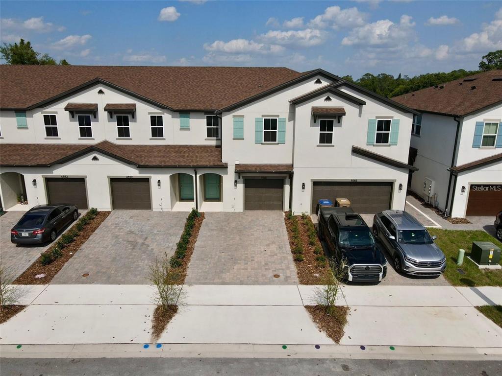 4561 Small Creek Road Kissimmee, FL 34744 - Photo 1 of 32 a front view of a house with garage