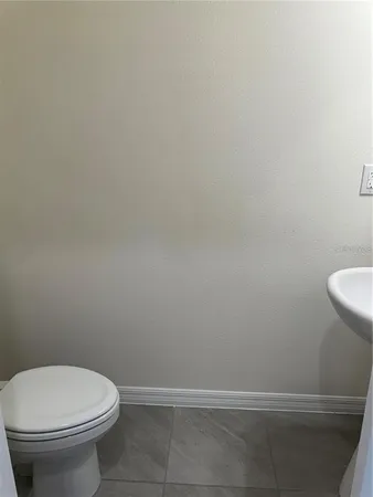 a bathroom with a toilet and a sink