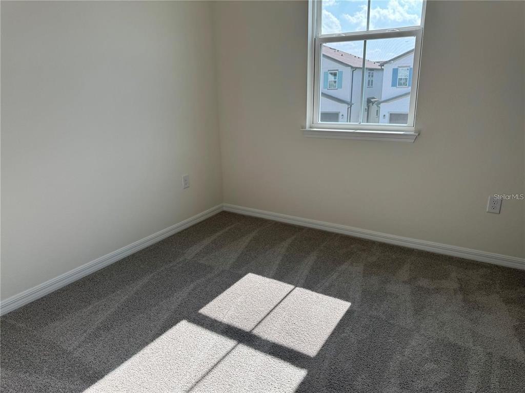 4561 Small Creek Road Kissimmee, FL 34744 - Photo 16 of 32 an empty room with a window