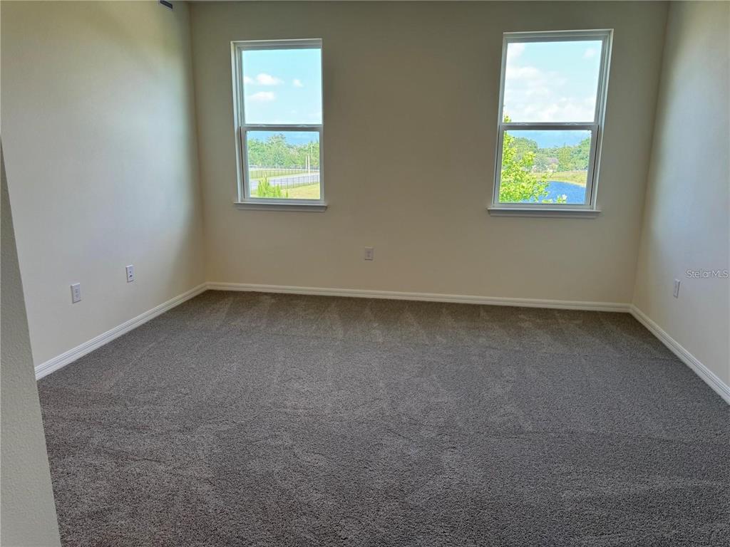 4561 Small Creek Road Kissimmee, FL 34744 - Photo 19 of 32 an empty room with a window